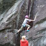 Maika climbs with Emily on belay