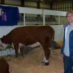 Jason is checking out a cow