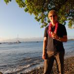 Jason enjoys his mai tai along the shore