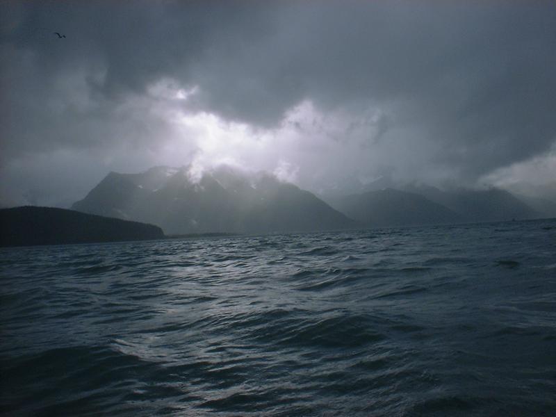 Sunshine peaks through the clouds at Seward