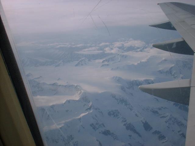 Flying home over snowcapped mountains