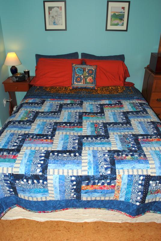 Showing off the comforter we received as a wedding present
