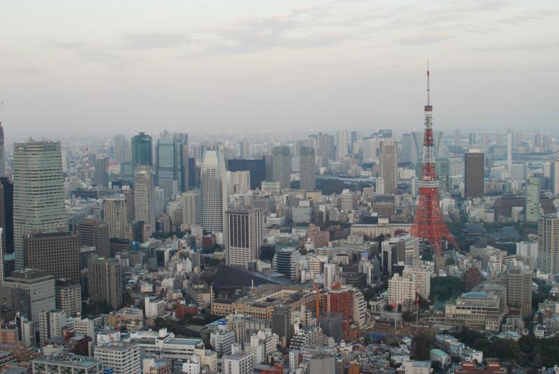 The Tokyo Tower and surrounding buildings at dusk, from the Mori