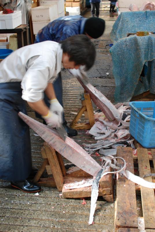 Removing the skin from frozen tuna