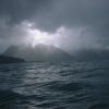 Sunshine peaks through the clouds at Seward