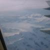 Flying home over snowcapped mountains