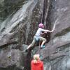 Maika climbs with Emily on belay