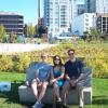 Jason, Celeste, and Matt sitting on the art