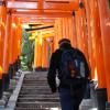 Jason climbing the stairs to the top of Inari Shrine