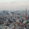 The Tokyo Tower and surrounding buildings at dusk, from the Mori